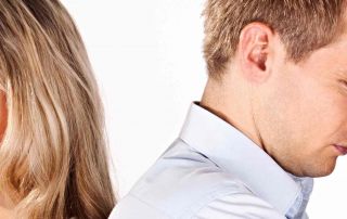 Man and woman couple facing the opposite way